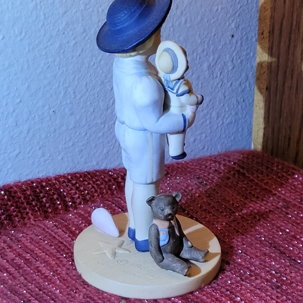 VINTAGE PORCELAIN BOY WITH DOLL FIGURINE 